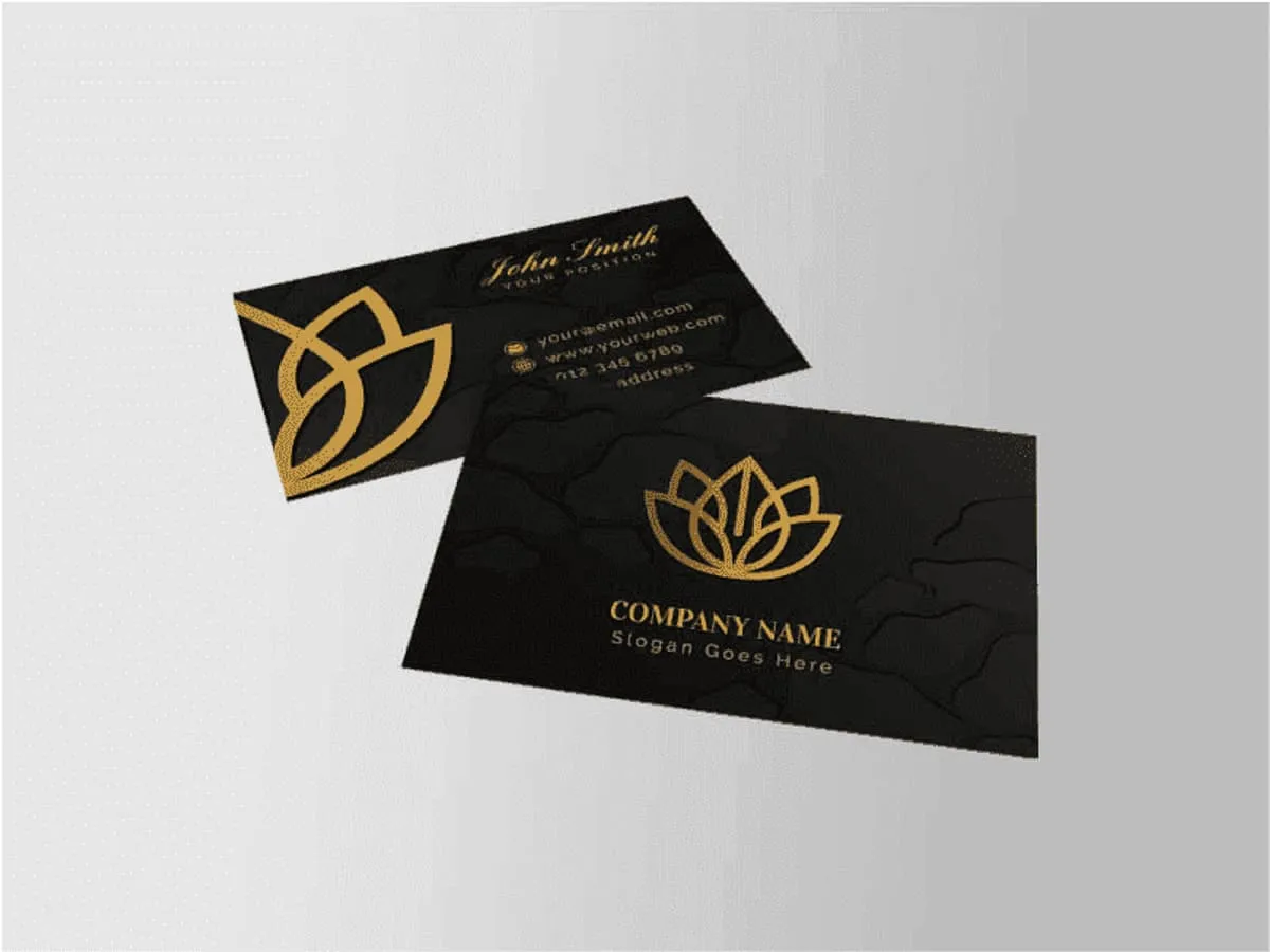 A business card with gold foil blocking on matt board