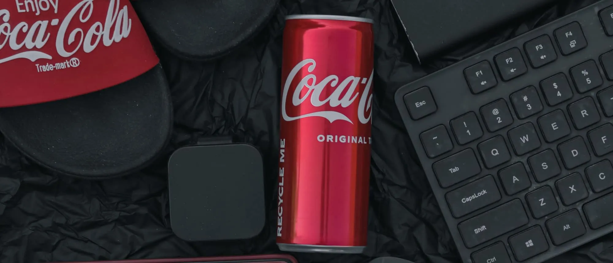 Branded corporate gift items arranged as a flat lay