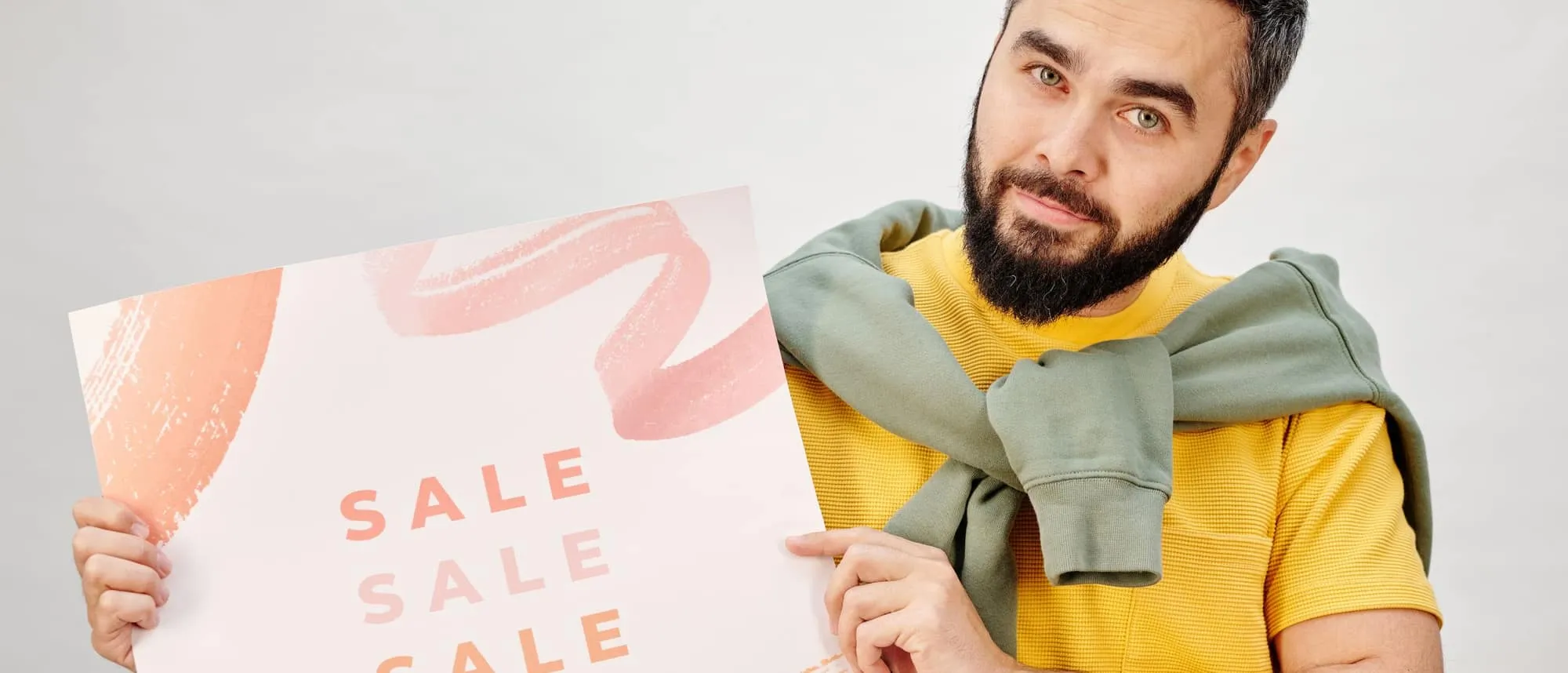 A person holding a printed promotional leaflet