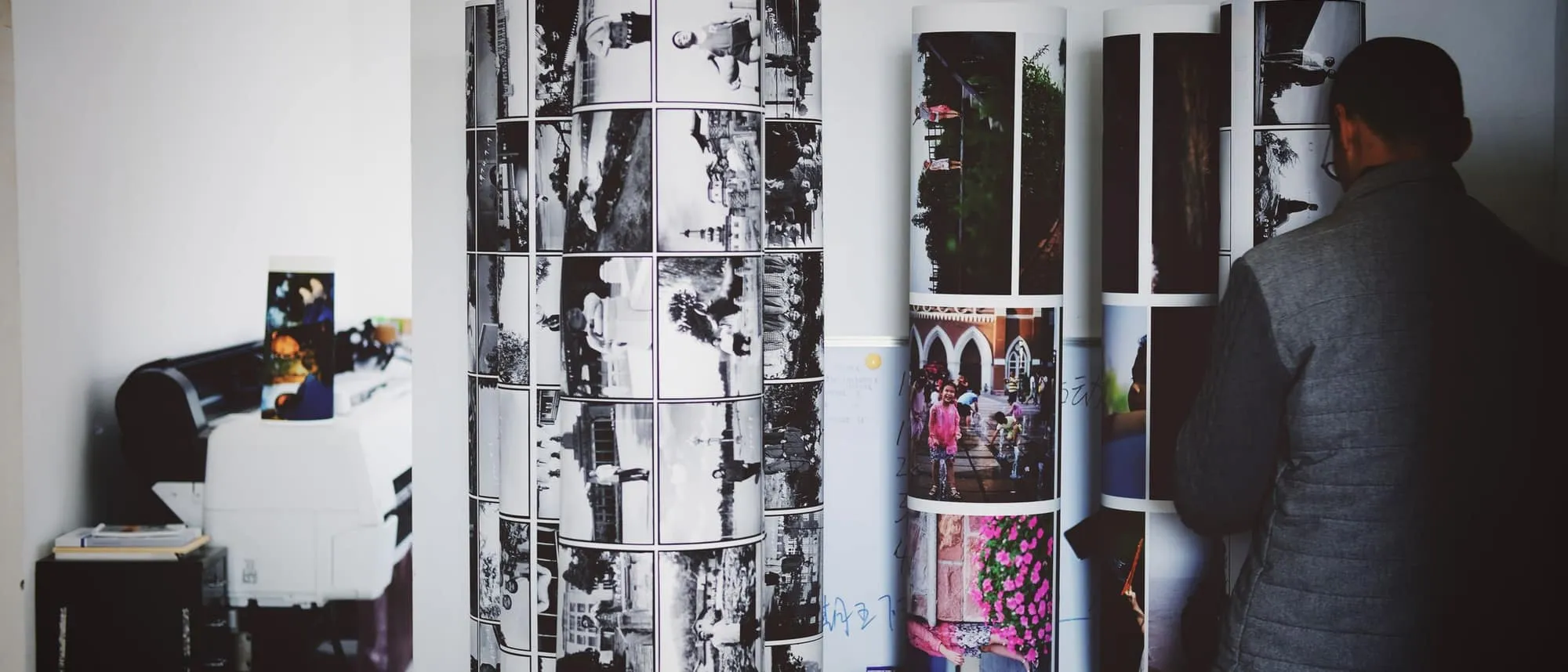 Large printed rolls being inspected in a studio
