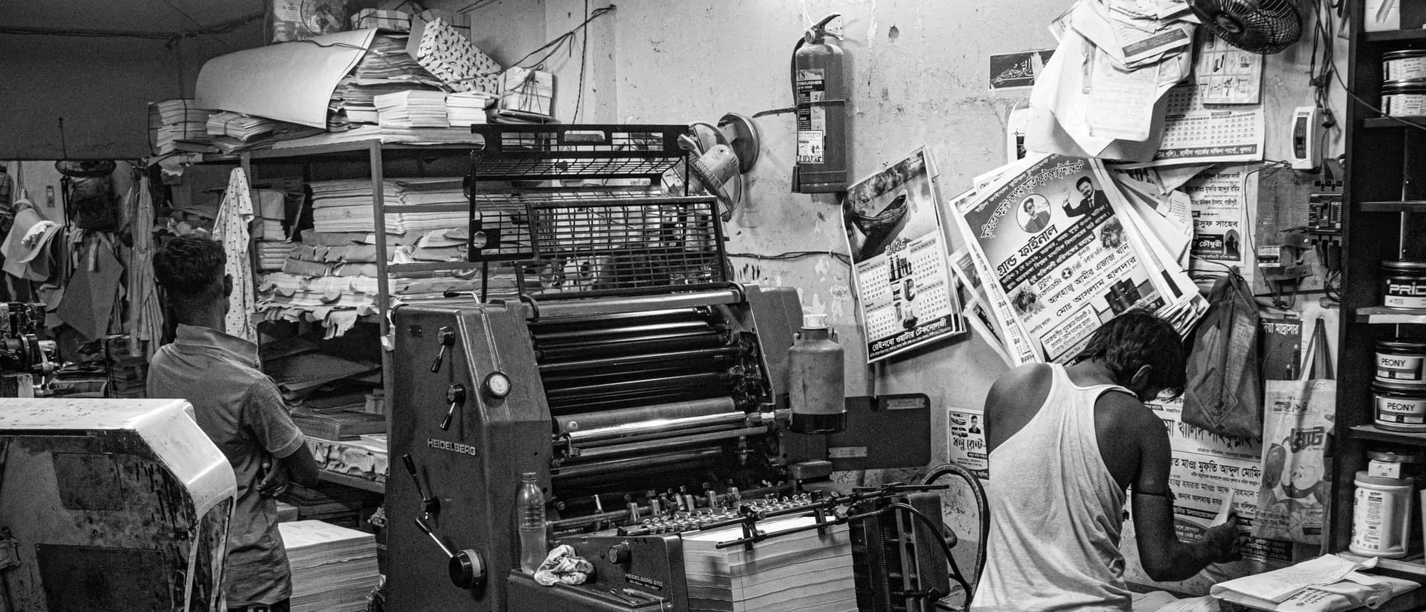 A working print shop photographed in black and white