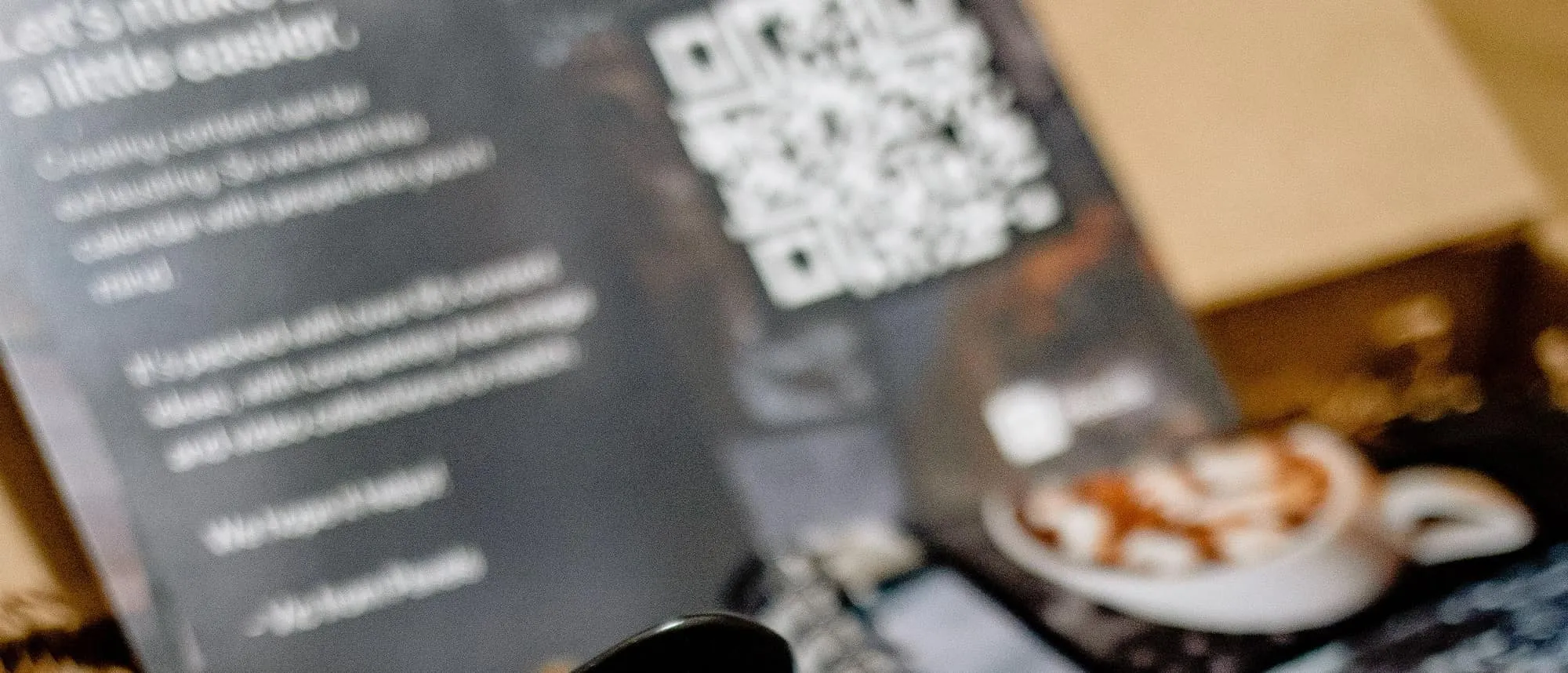A branded mug and notepad presented in a gift box