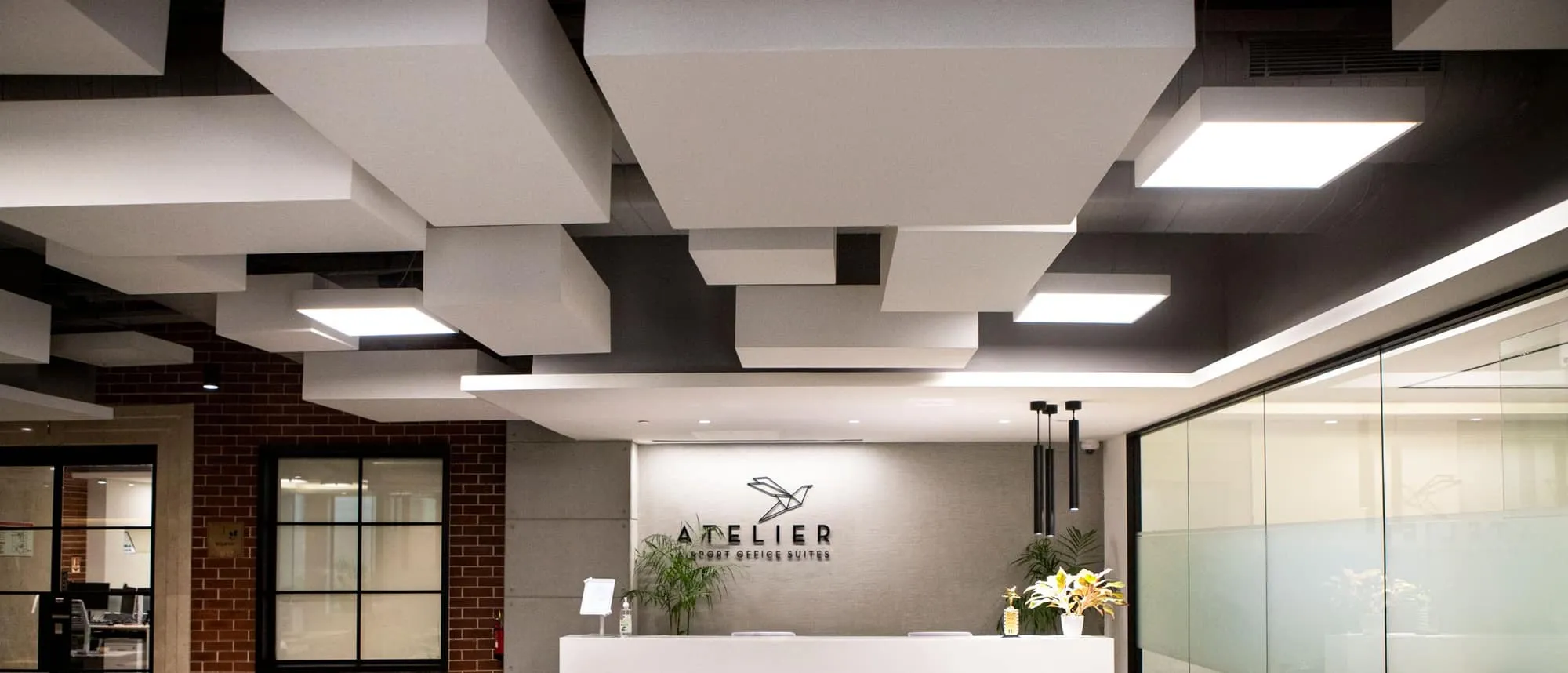 Dimensional lettering on the wall behind an office reception desk