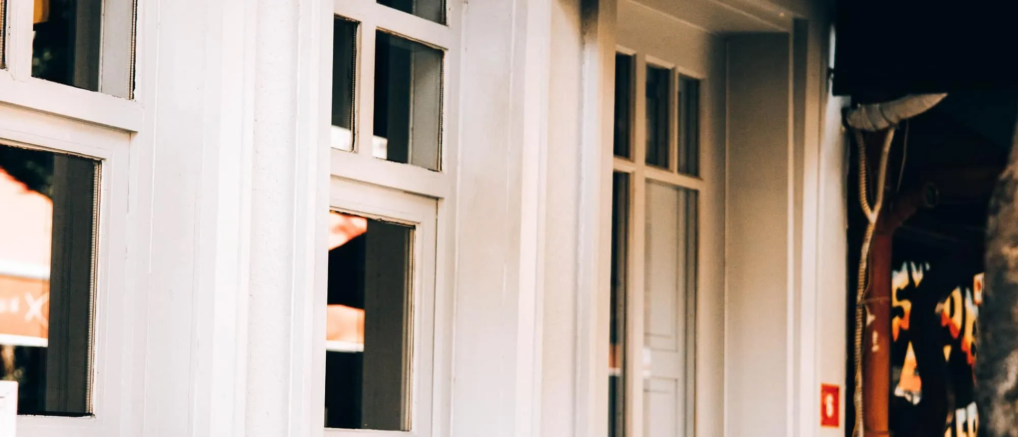 A small retail shopfront with window signage