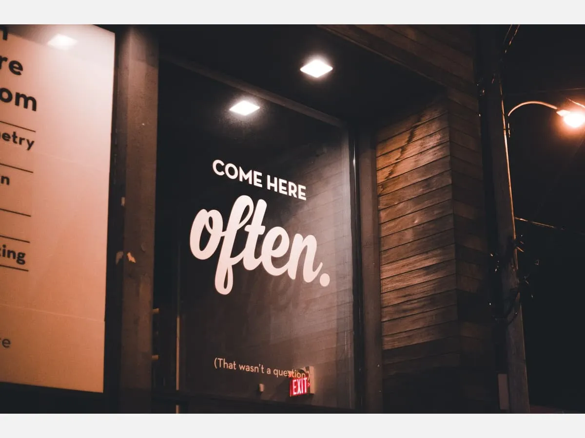 Illuminated lettering inside a retail entrance