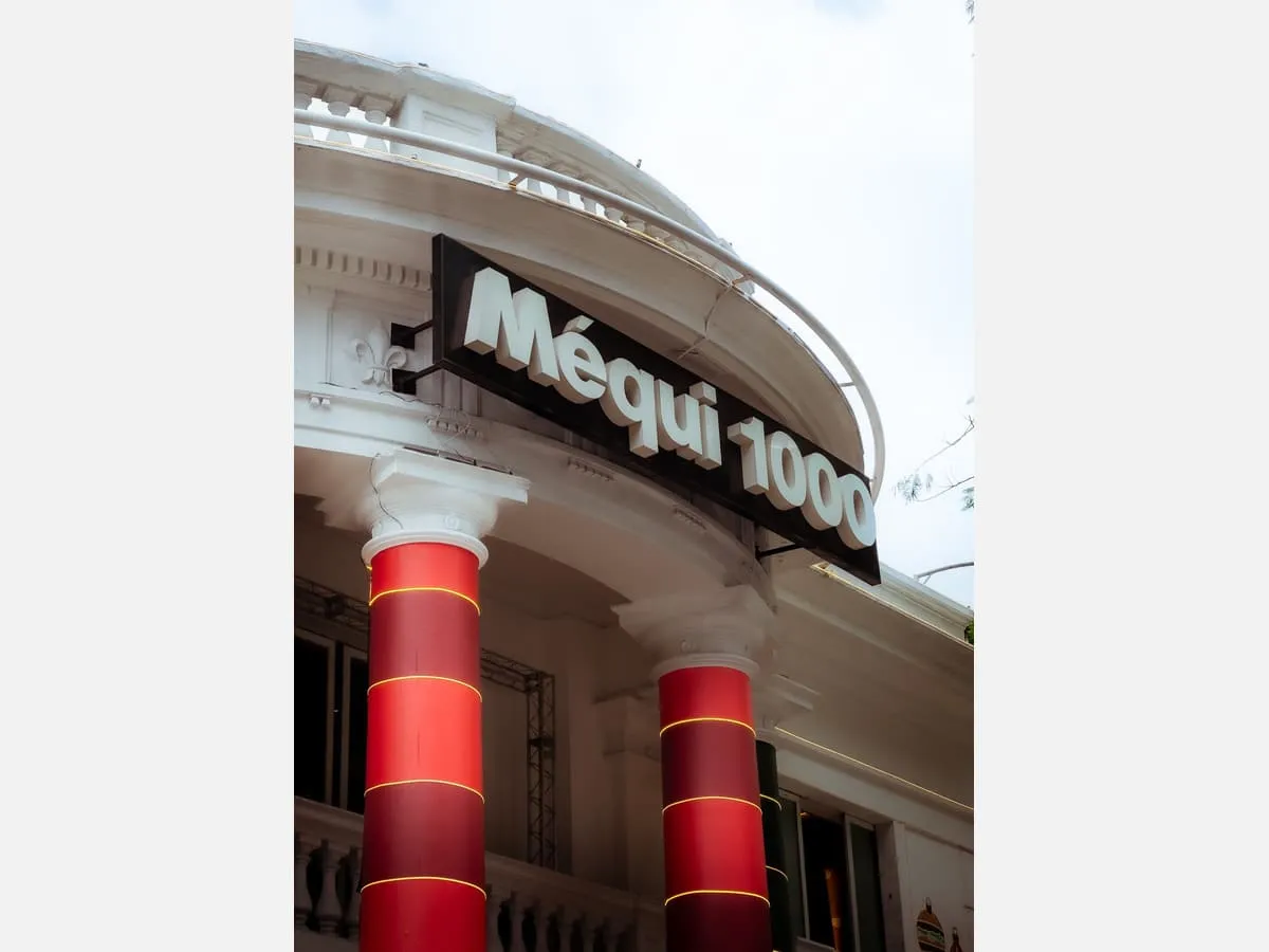 Dimensional letters mounted across a curved building facade