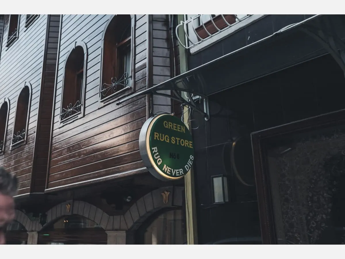 A projecting sign mounted on a building corner