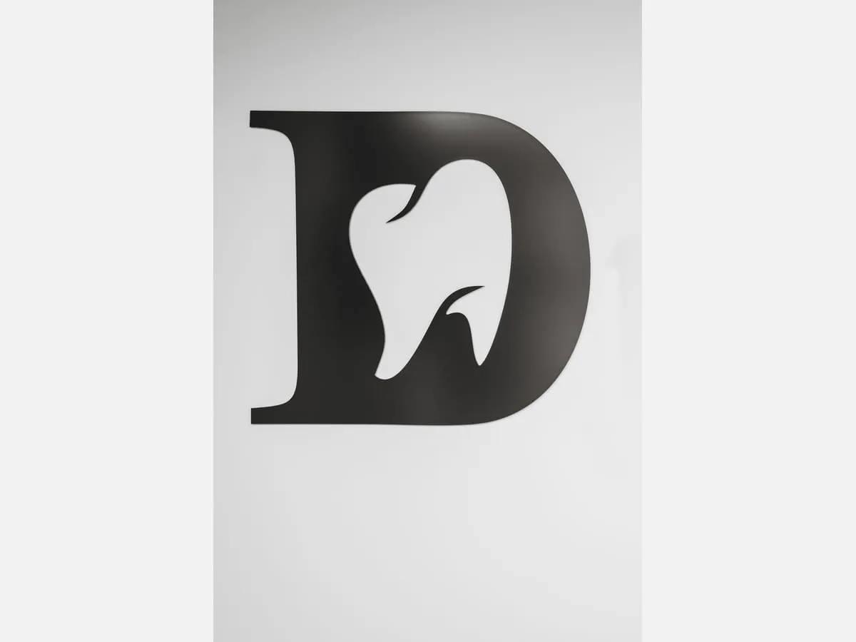 A large logo mark applied to a reception wall