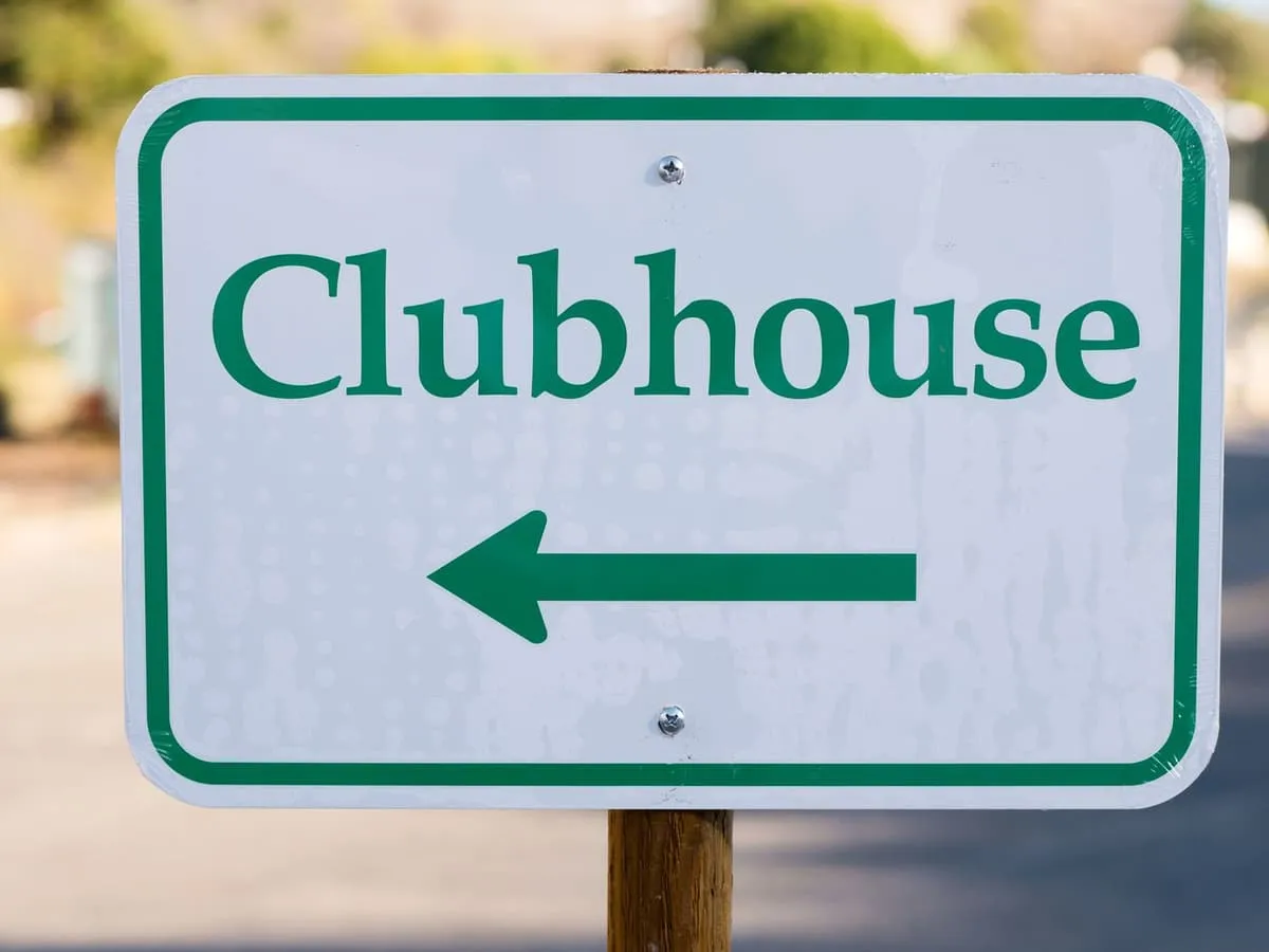 A directional sign naming a destination with an arrow