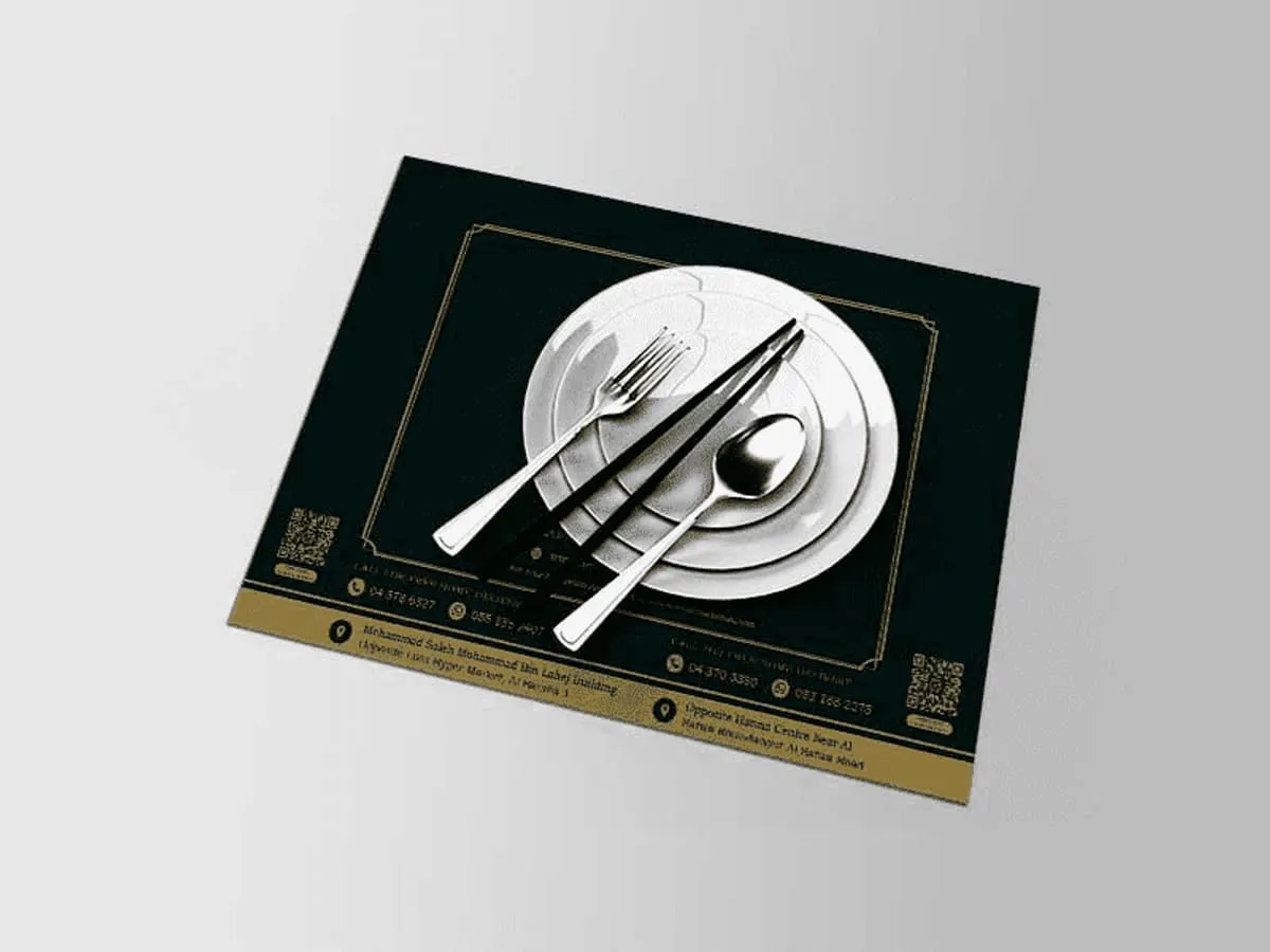 Printed paper table mats laid on a restaurant table